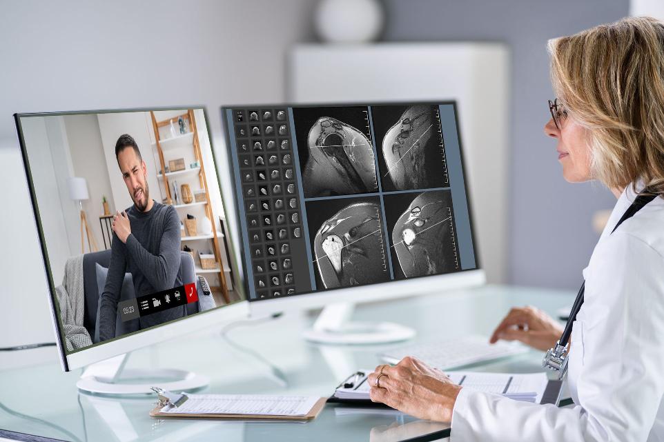 Doctor talking to patient online about his shoulder